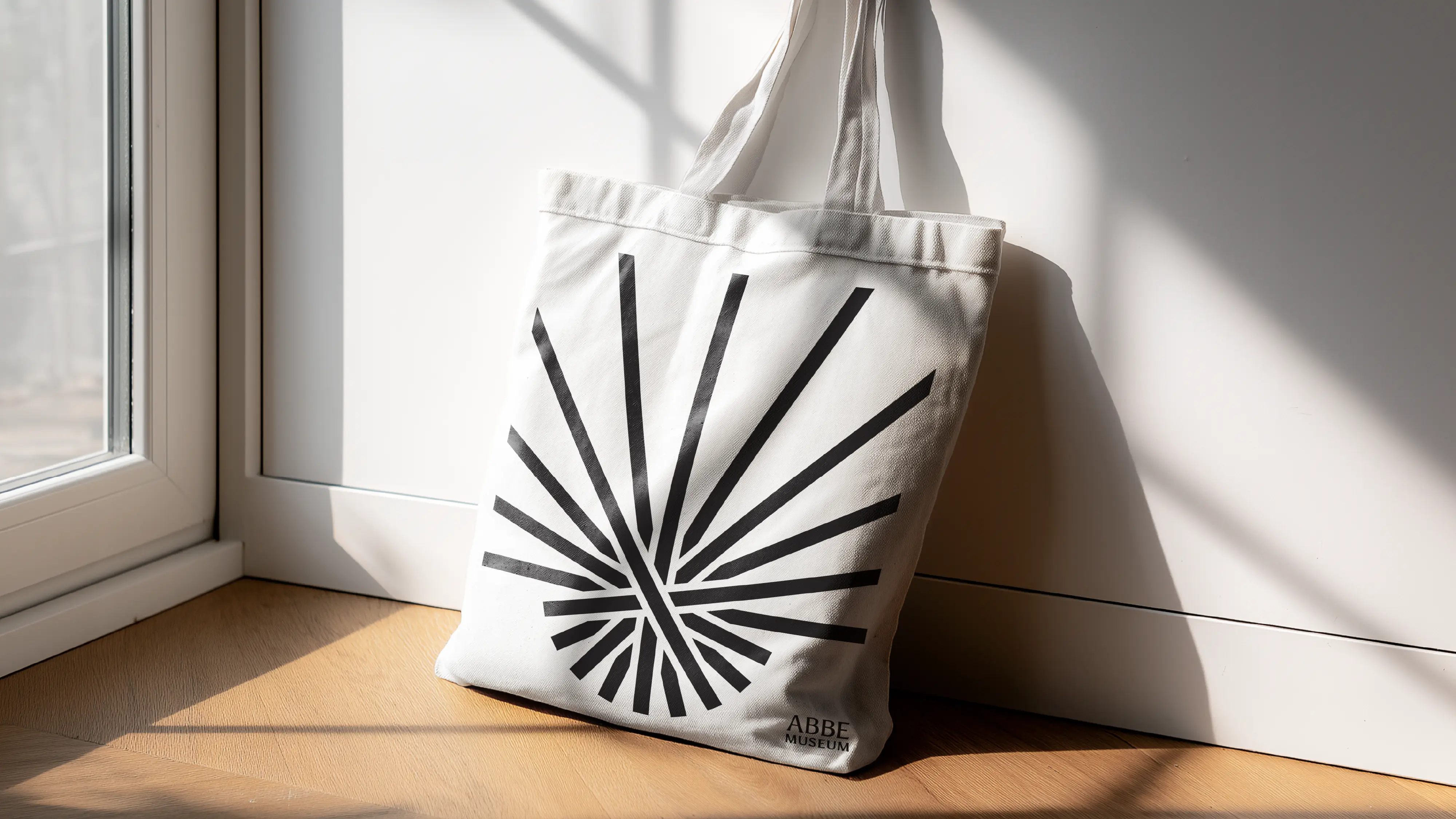 Abbe Museum brand redesign in use: graphic tote bag merch. Brand identity design by In-House International  weareinhouse.com