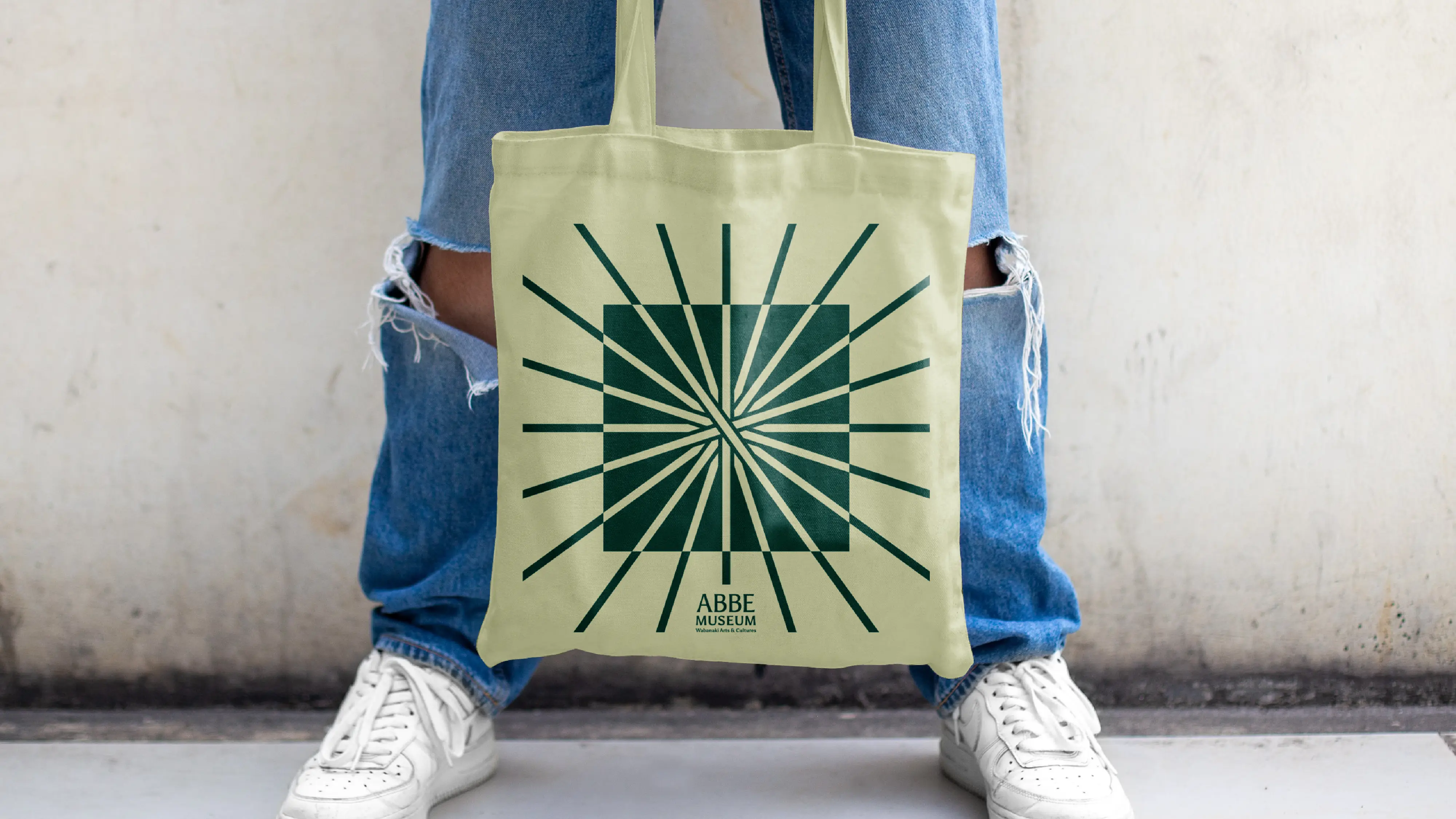 Abbe Museum new brand application - tote bag radial green on green. Branding by In-House International.